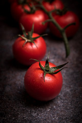 Fresh grape tomatoes  on rustic background
