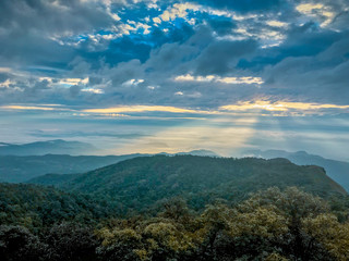 Fototapeta premium light ray and cloud on top of the mountain at Chaing mai, Thailand