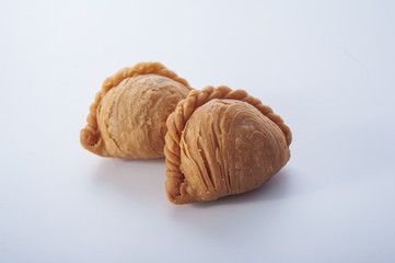 Traditional curry puffs stuffed chicken on white background
