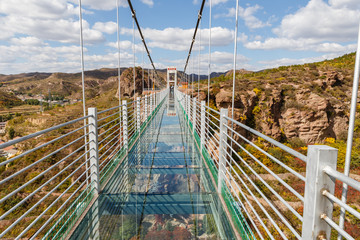 glass suspension bridge in the mountains
