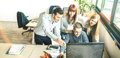 Young people employee coworkers at startup business meeting in urban coworking space studio - Human...