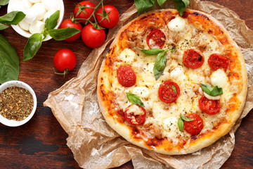 Homemade Pizza Margarita with Tomatoes, Basil and Mozzarella Cheese