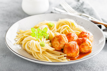 Spaghetti with meatballs in tomato sauce