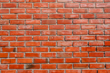 Beautiful orange color weathered old retro and grunge dirty white paint bricks wall background texture in rural room. The rusty blocks of stonework technology color horizontal architecture wallpaper