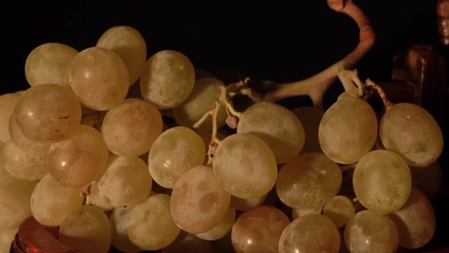 More closer view and backward rotating wine barrel with grape.
