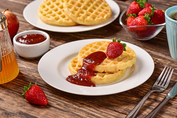Waffles and jam on breakfast table