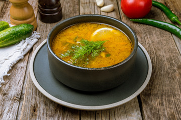 Fish soup on white plate