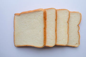 Top view and close up: slice of bread on white background. Breakfast concept.
