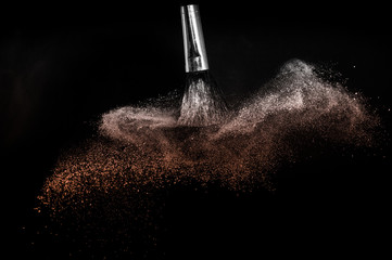 Living Coral Color of the year 2019, powder splash and brush for makeup artist or beauty blogger in black background