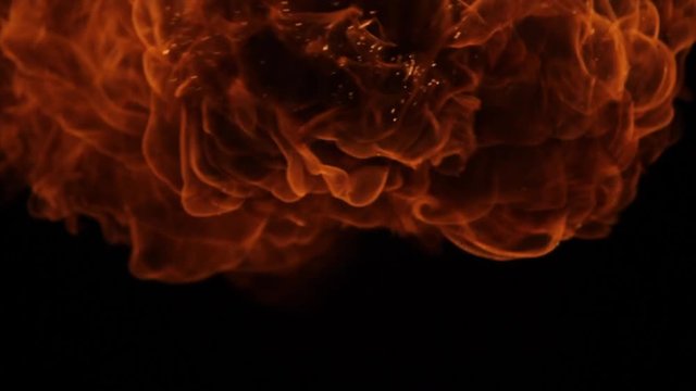 Fire ball explosion, high speed camera, isolated fire flame on black background, slow motion.
