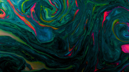 Psychedelic abstract bright colors mixed in a liquid