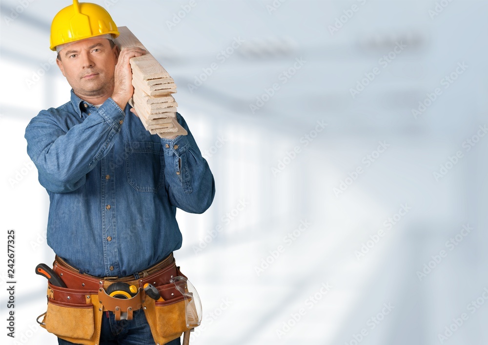 Poster construction worker with tools in empty building