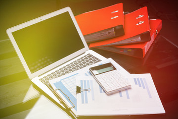 Office workplace with documents and stationery near red folders