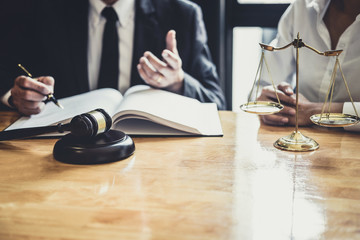 Male lawyer or Counselor working in courtroom have meeting with client are consultation with contract papers of real estate, Law and Legal services concept