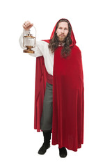 Medieval man in cape with lamp isolated