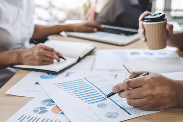 Business team colleagues discussing working analysis with financial data and marketing growth report graph in team, Meeting Talking Brainstorming Communication Concept