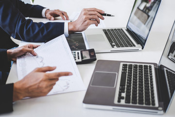 Business team investment working with computer and analysis graph stock market trading with stock chart data, business and technology concept