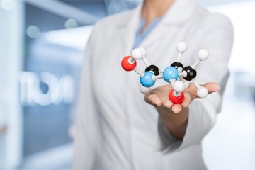 Close up of Molecular structure model in hand on background