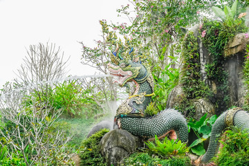 Statue on natural background, waterfall model is beautiful, For tourists to photograph in tourist attractions,Suanthai Pattaya