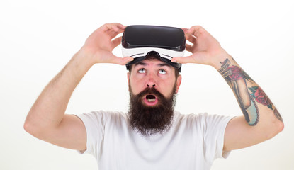 Person with virtual reality helmet isolated on white background. Happy bearded man wearing virtual reality goggles watching movies or playing video games. VR games.
