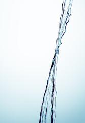 A jet of water on a blue background