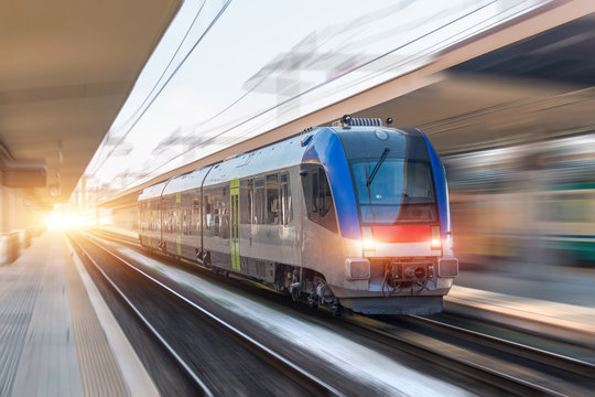 Railroad travel passenger train with motion blur effect, industrial concept, tourism.
