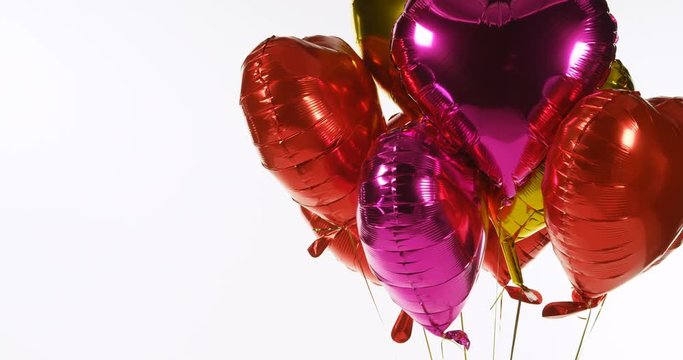 Multicoloured balloons floating in the air 4k