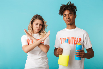 Angry confident multiethnic couple wearing volunteers