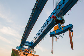 Construction crane and girder of bridge construction site.New expressway construction site and...