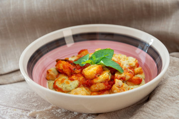 Dish made with cooked duck meat, dehydrated potato, fresh cream of mushroom and cheese