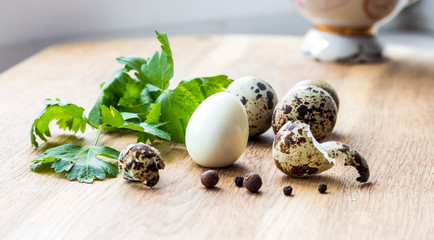 hard boiled quail egg has been shelled, among other eggs