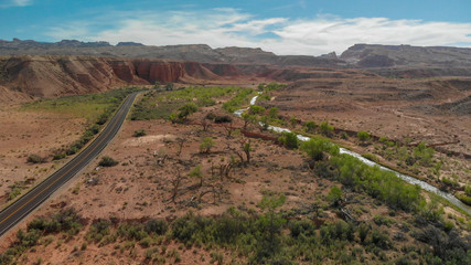 Road crossin beautiful canyon in summer season, aerial view
