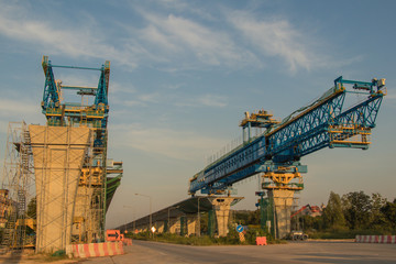 Construction crane and girder of bridge construction site.New expressway construction site and...