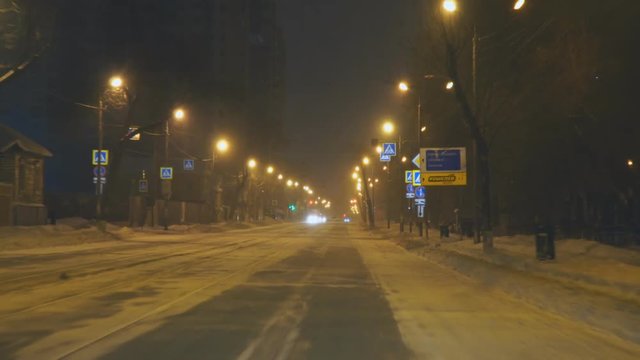 Driving on the night road in winter
