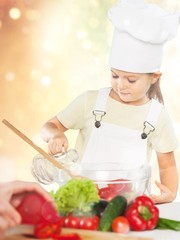 Portrait of adorable little girl preparing healthy food at