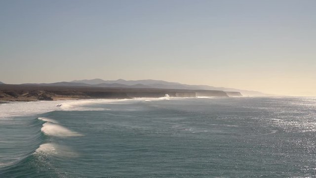 Coastline with a steep coast and the Atlantic Ocean, El Cotillo, Fuerteventura, Spain