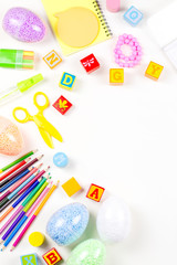 School supplies, child creativity concept flat lay. Various artistic tools for children on white desktop. Copy space