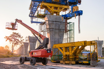 Construction crane and girder of bridge construction site.New expressway construction site and equipment.