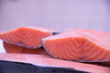 Fresh tasty salmon steaks close up ready for sale