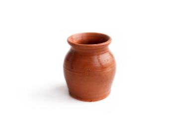 Clay pot, made by hand on a potter's wheel from red clay. Double burning. Transparent glaze applied by hand - visible potter's fingerprints and brush strokes. Handmade, single copy.  isolated