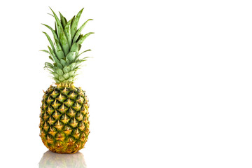 Ripe, small pineapple on a white background, isolate.