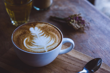 coffee hot drink cappucino latte art on wood vintage table , coffee time on wood background cafe