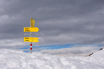 hiking information signs in the mountains covered in snow in Tirol, Austria