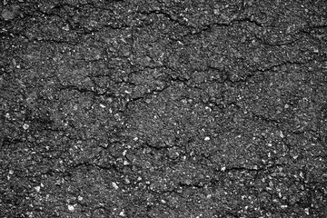 crack and texture of asphalt road - top view background.