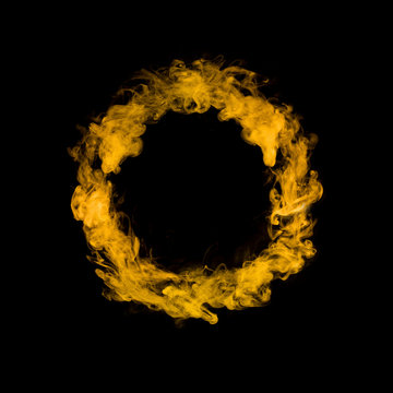 Circle From Yellow Colorful Smoke Isolated On Black Background