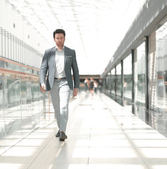 businessman walking in the airport building