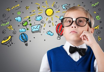 Portrait of a cute young boy with glasses isolated on