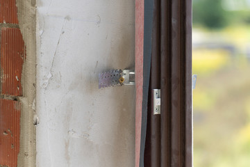 Phot of anchor plate on new window frame