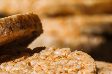 Salty rice crackers galettes with spices. Tasty salty healthy biscuits.