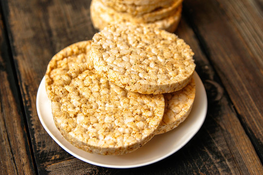 Salty rice crackers galettes with spices. Tasty salty healthy biscuits.